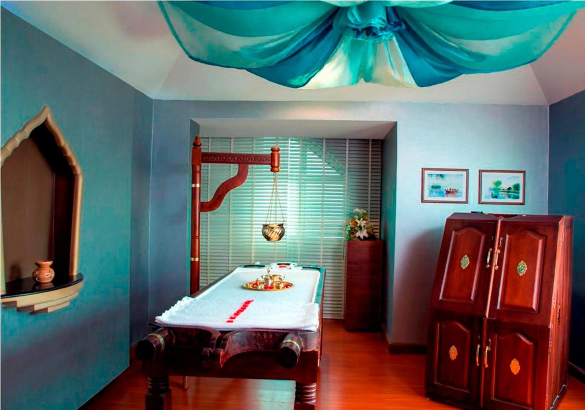 a bathroom with a sink and a shower in a room at Radisson Blu Kochi in Cochin