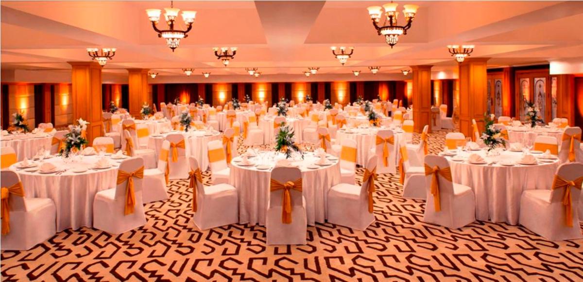 a banquet hall with white tables and chairs at Radisson Blu Kochi in Cochin +58 photos
