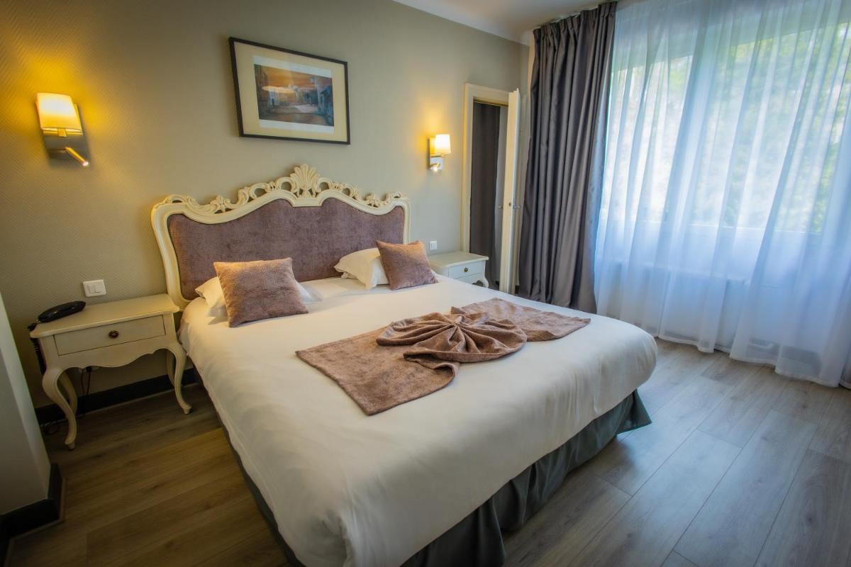 Un ou plusieurs lits dans un hébergement de l'établissement Alexain Hotel Restaurant & Wellness - Colmar Ouest