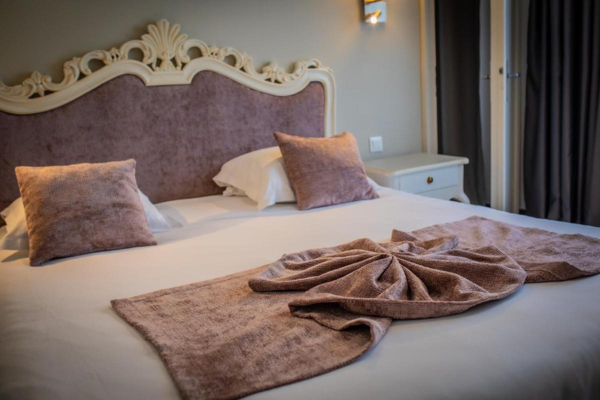 Un ou plusieurs lits dans un hébergement de l'établissement Alexain Hotel Restaurant & Wellness - Colmar Ouest