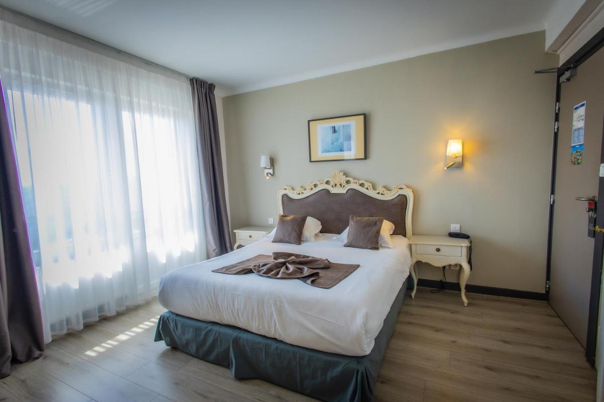Un ou plusieurs lits dans un hébergement de l'établissement Alexain Hotel Restaurant & Wellness - Colmar Ouest
