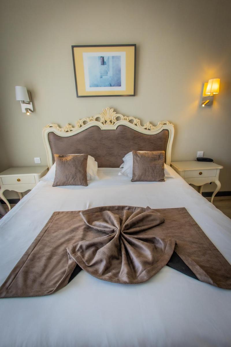 Un ou plusieurs lits dans un hébergement de l'établissement Alexain Hotel Restaurant & Wellness - Colmar Ouest