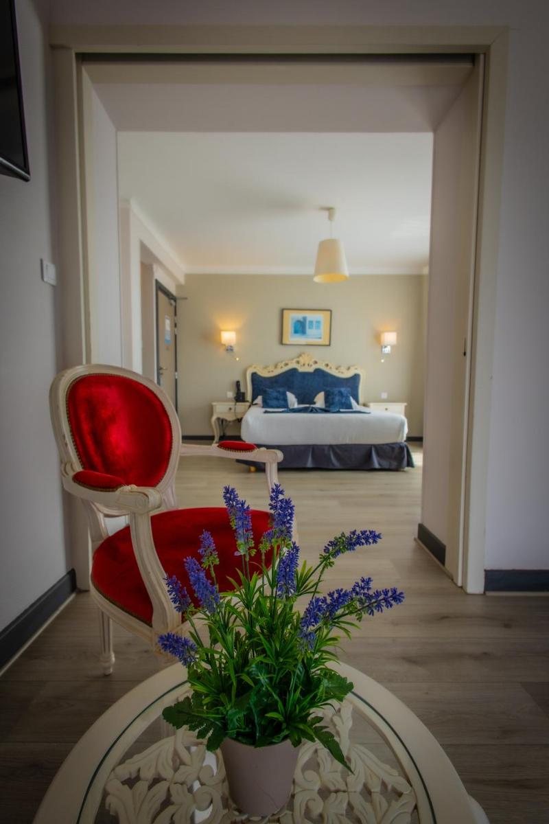 Un ou plusieurs lits dans un hébergement de l'établissement Alexain Hotel Restaurant & Wellness - Colmar Ouest