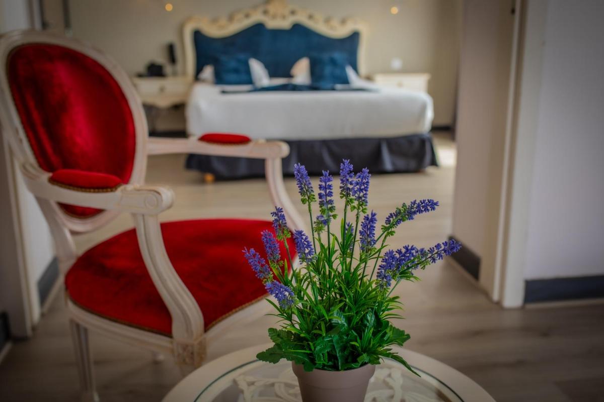 Un ou plusieurs lits dans un hébergement de l'établissement Alexain Hotel Restaurant & Wellness - Colmar Ouest