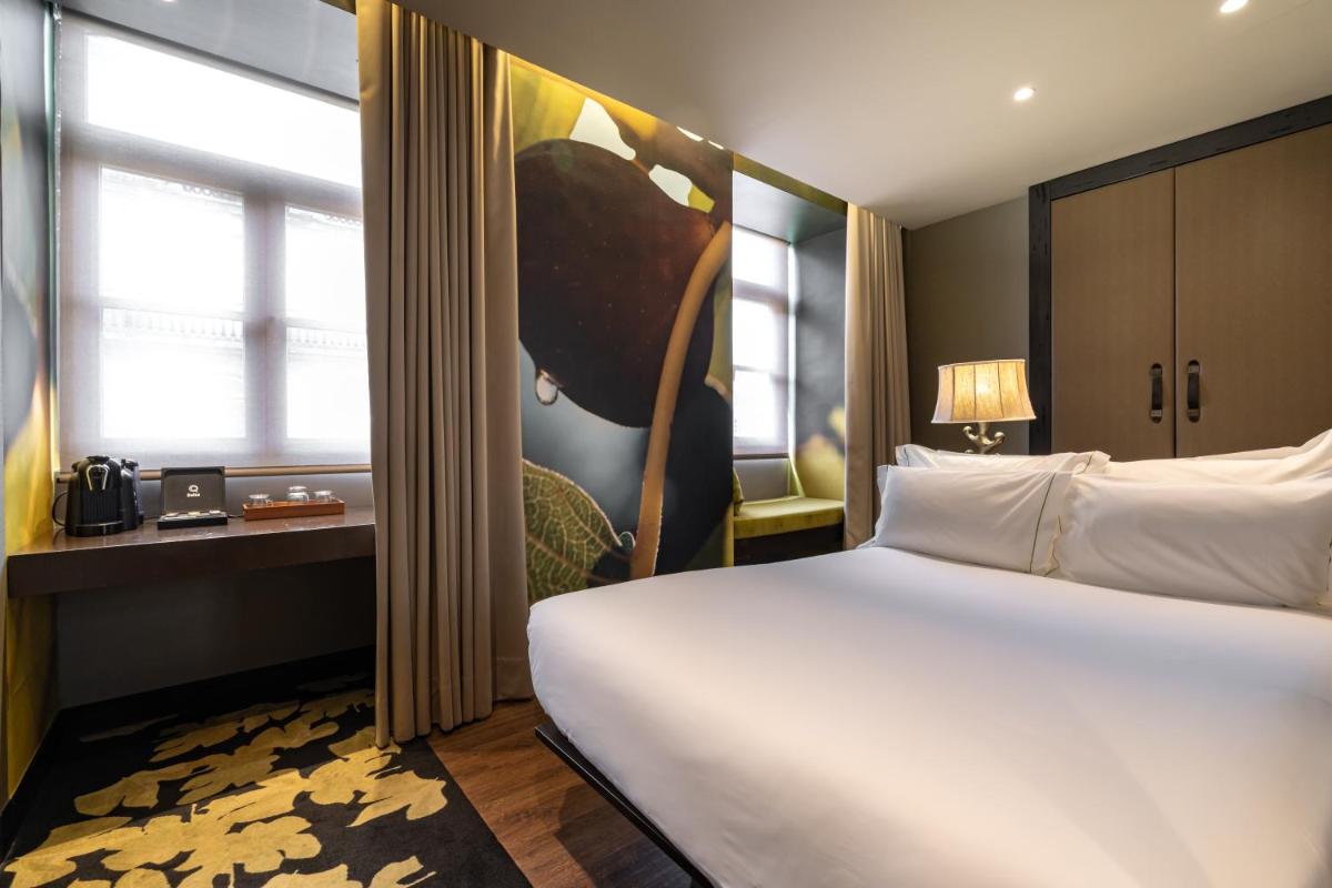 Uma cama ou camas num quarto em Figueira by The Beautique Hotels & Spa