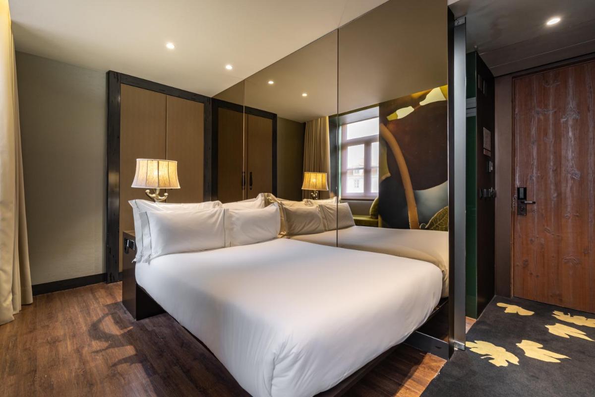 Uma cama ou camas num quarto em Figueira by The Beautique Hotels & Spa