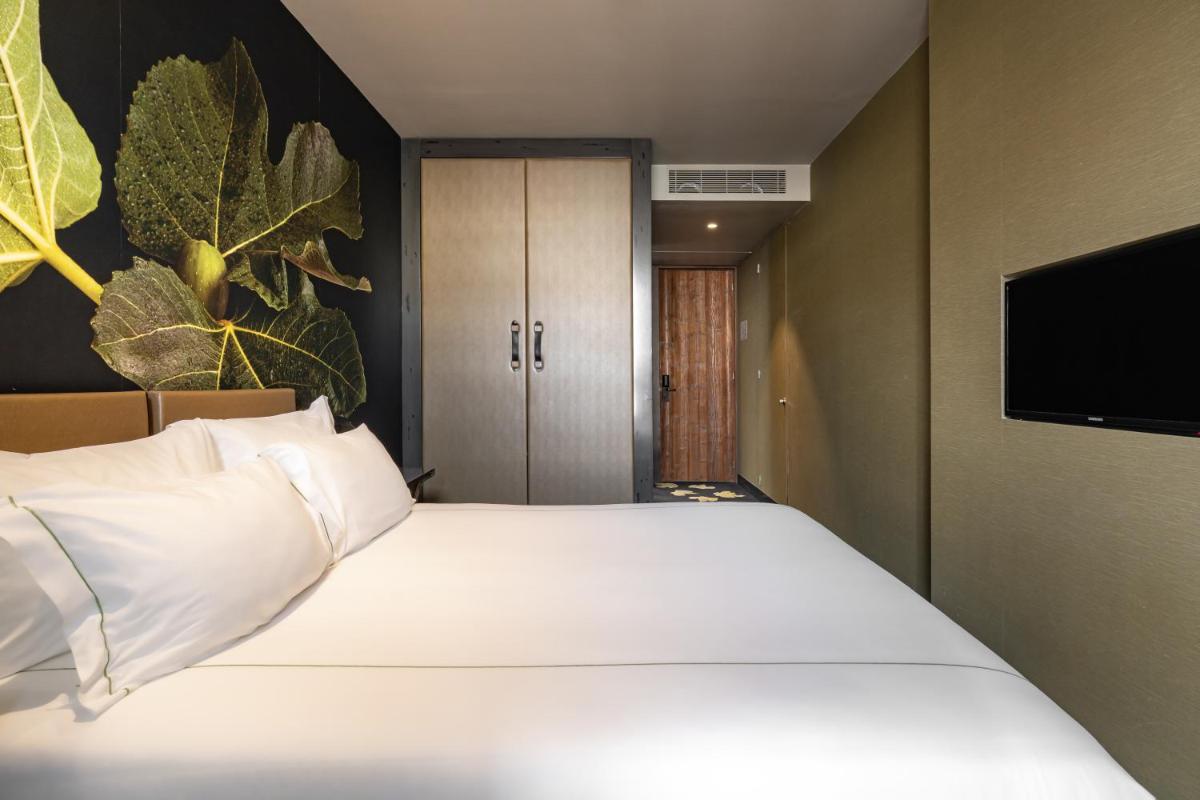 Uma cama ou camas num quarto em Figueira by The Beautique Hotels & Spa