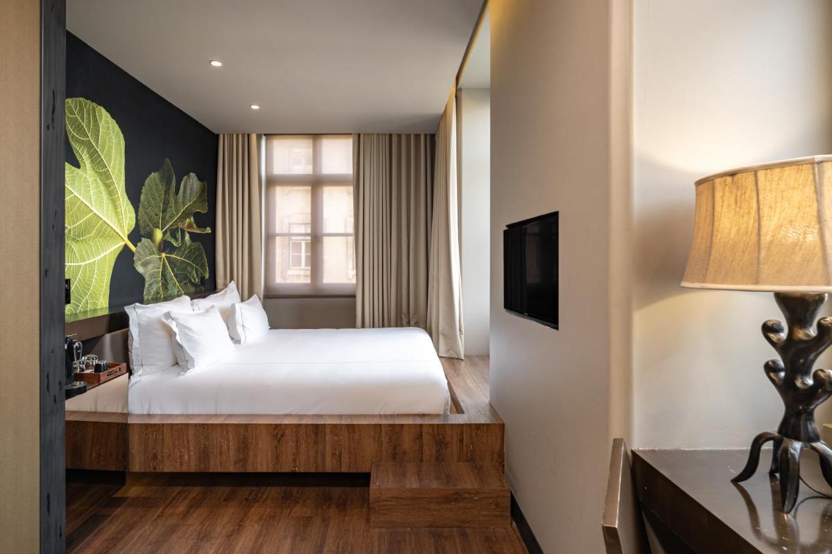 Uma cama ou camas num quarto em Figueira by The Beautique Hotels & Spa