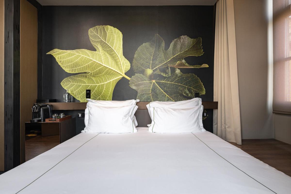 Uma cama ou camas num quarto em Figueira by The Beautique Hotels & Spa