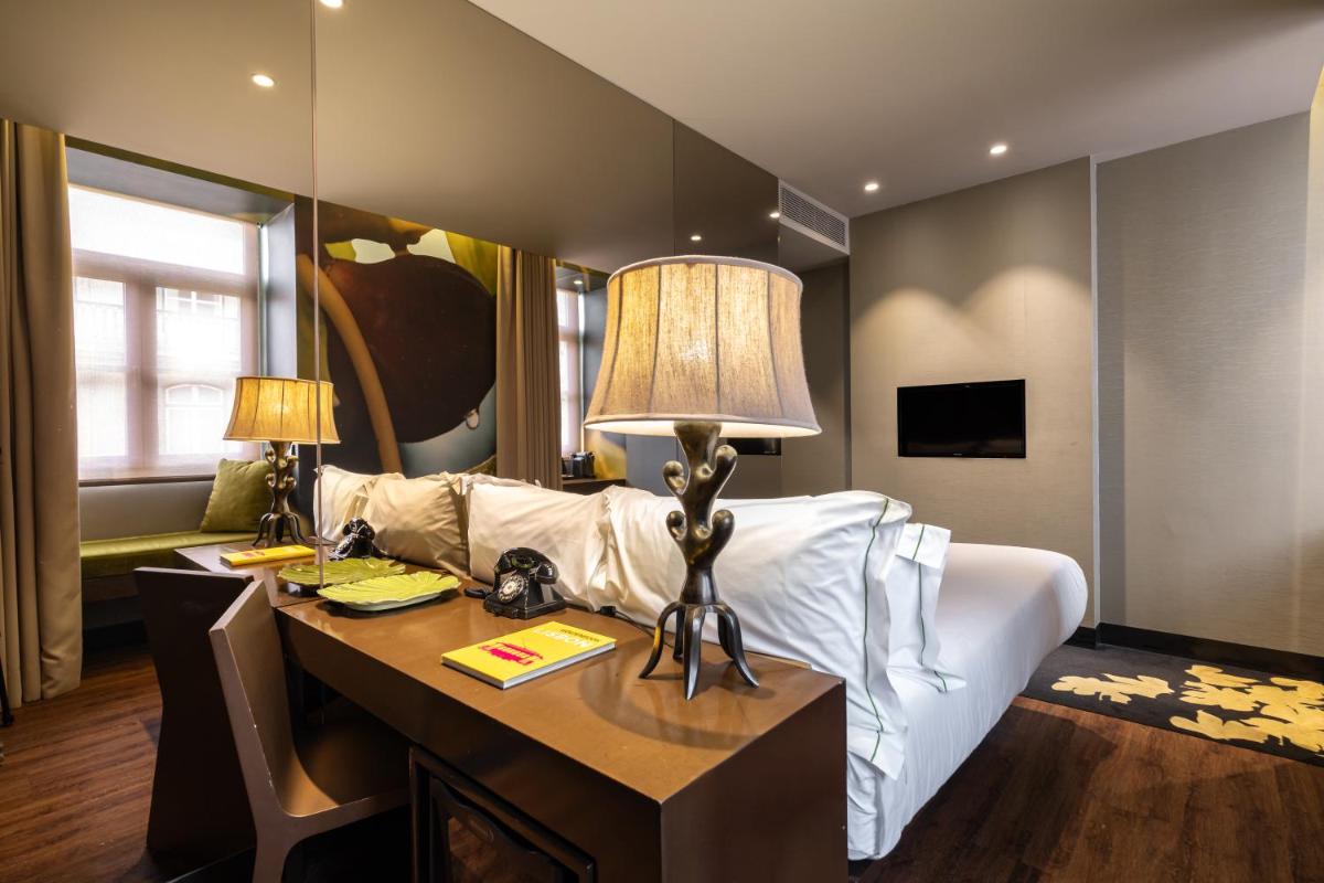 Uma cama ou camas num quarto em Figueira by The Beautique Hotels & Spa