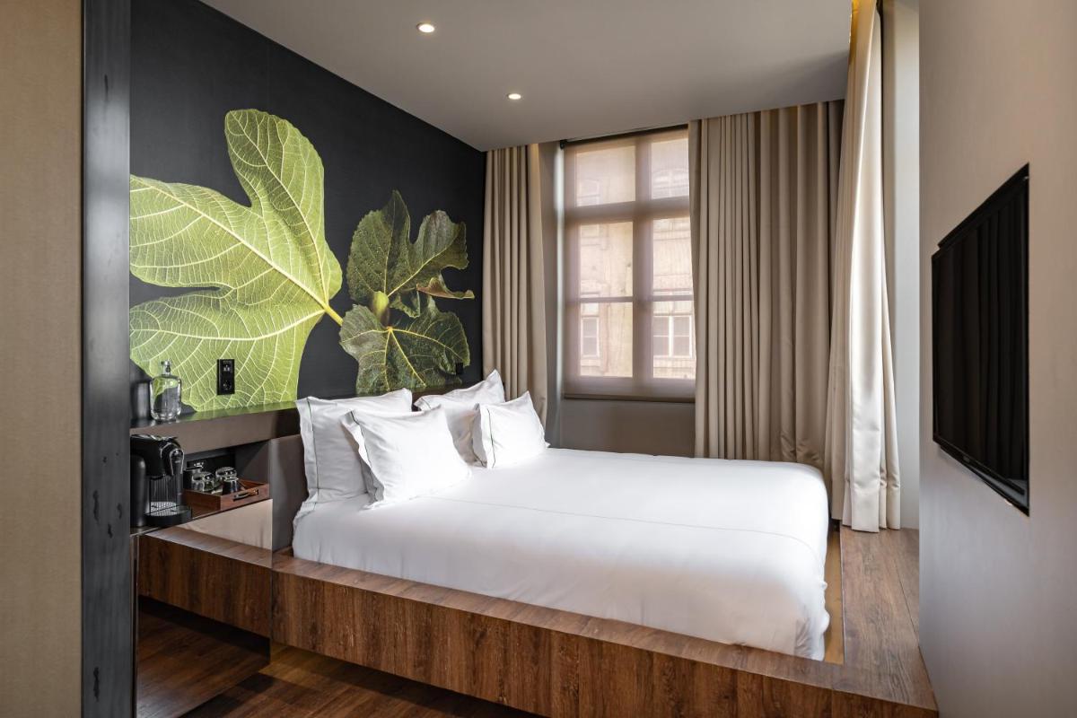 Uma cama ou camas num quarto em Figueira by The Beautique Hotels & Spa