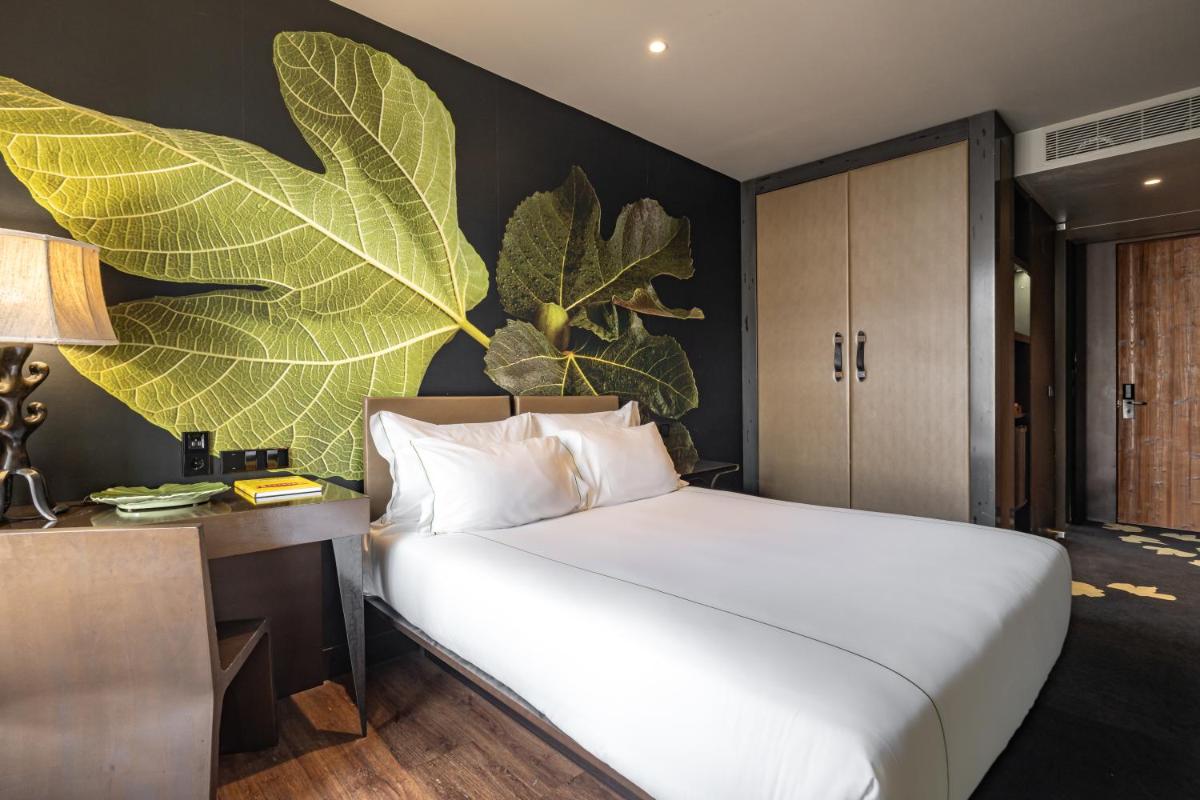 Uma cama ou camas num quarto em Figueira by The Beautique Hotels & Spa
