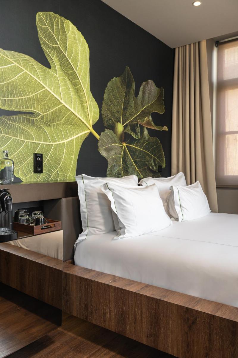 Uma cama ou camas num quarto em Figueira by The Beautique Hotels & Spa