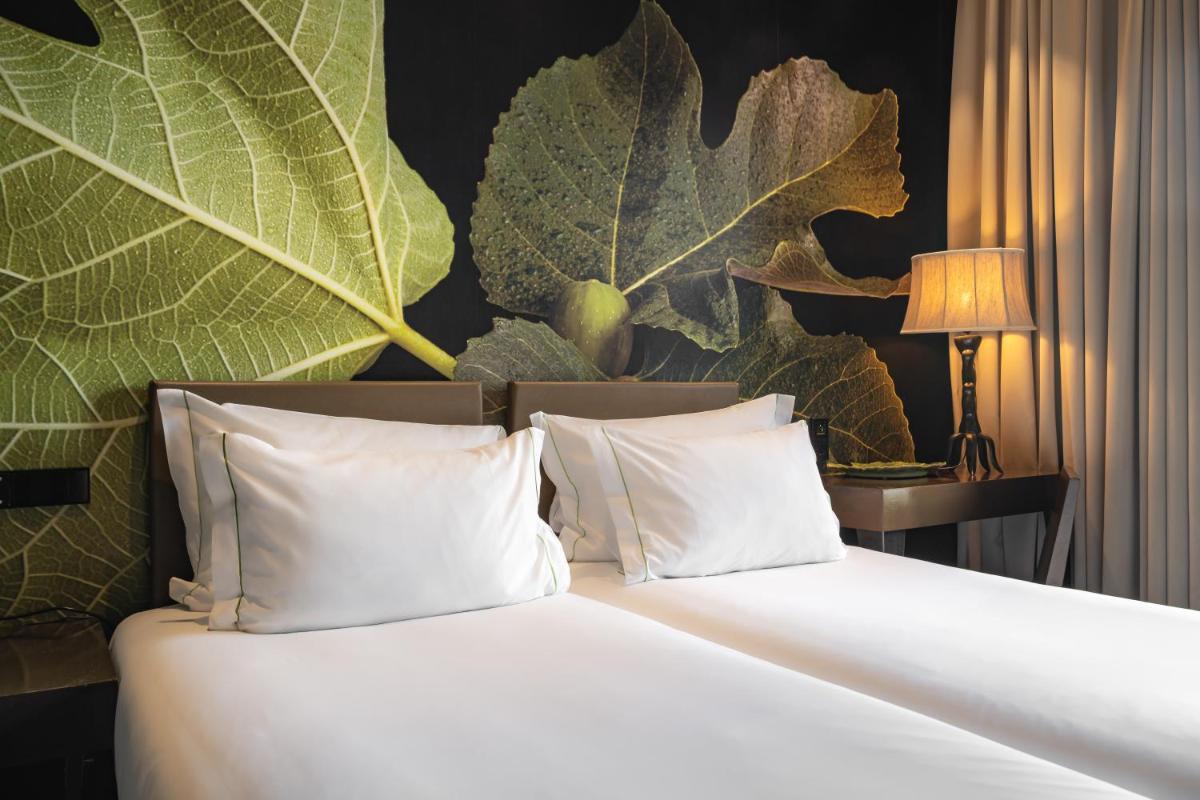 Uma cama ou camas num quarto em Figueira by The Beautique Hotels & Spa