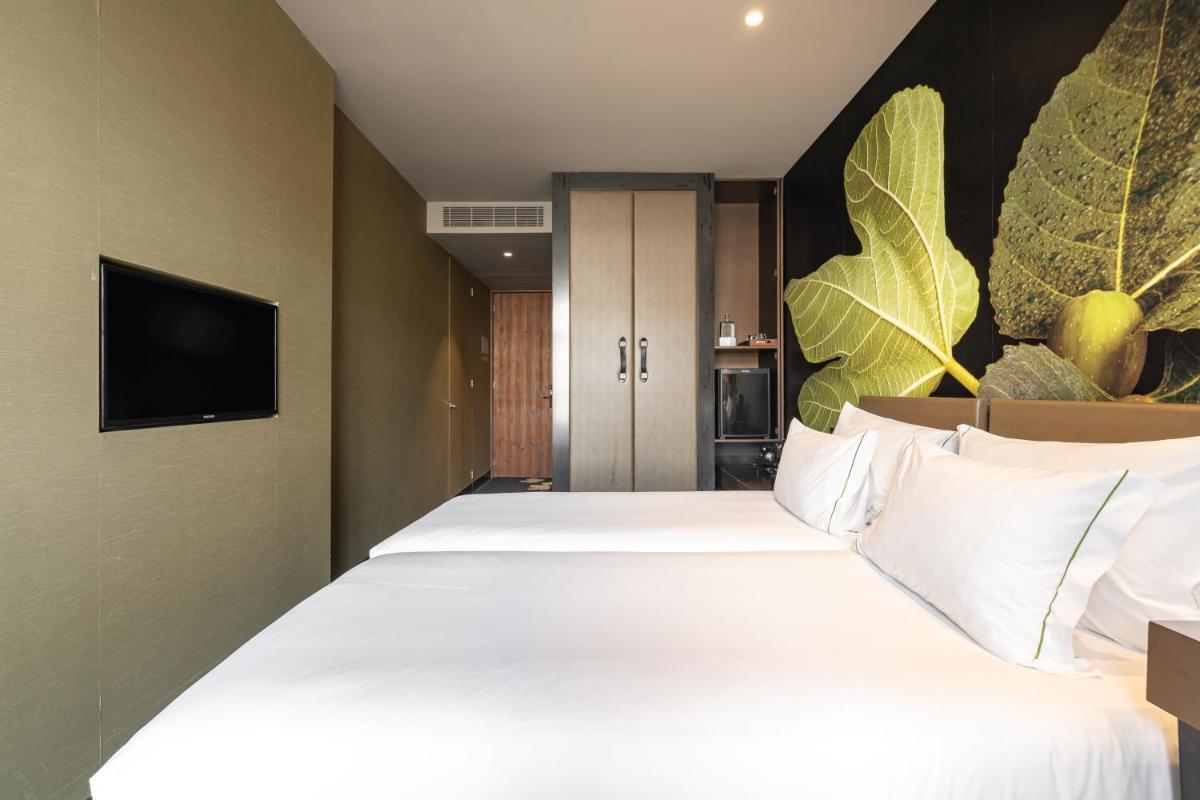 Uma cama ou camas num quarto em Figueira by The Beautique Hotels & Spa