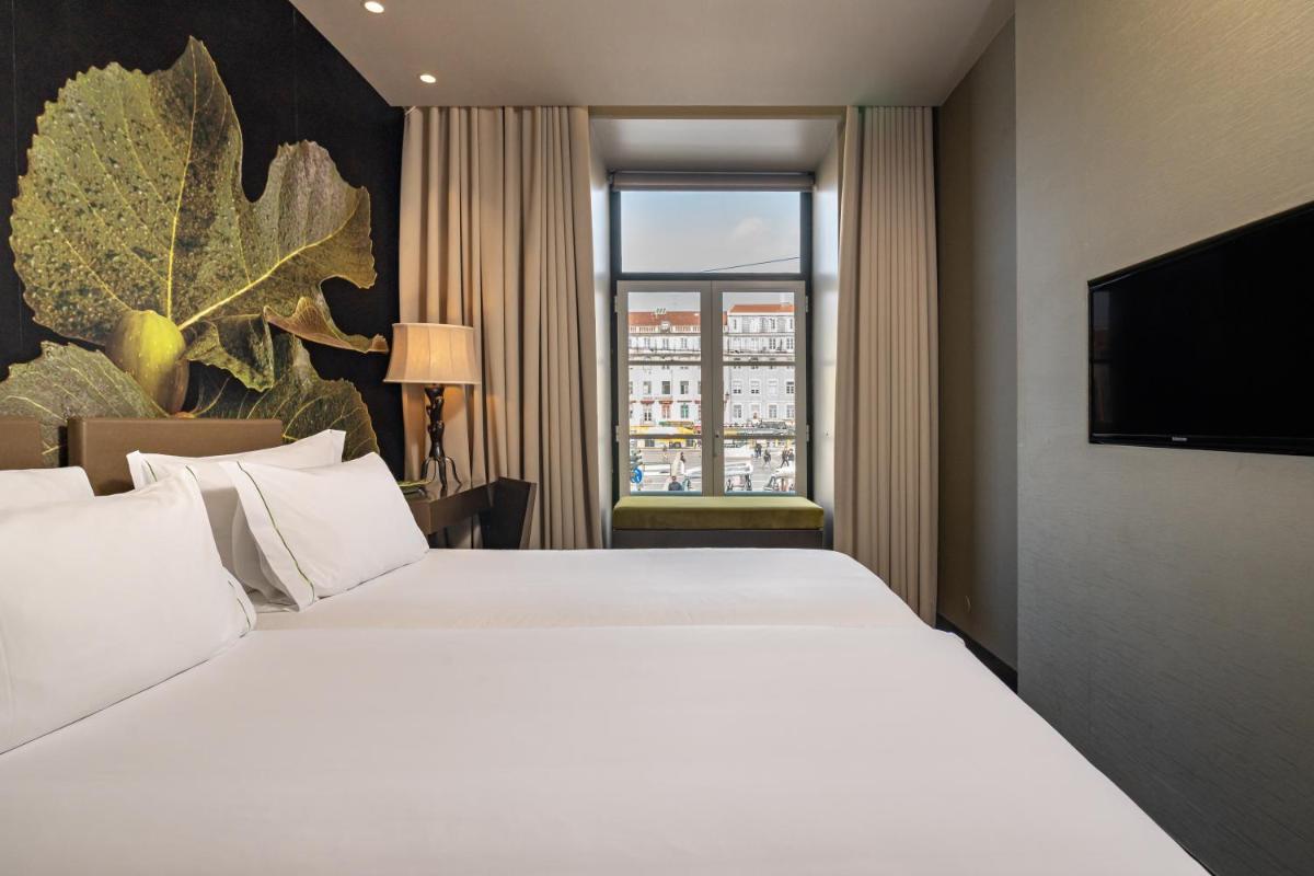 Uma cama ou camas num quarto em Figueira by The Beautique Hotels & Spa