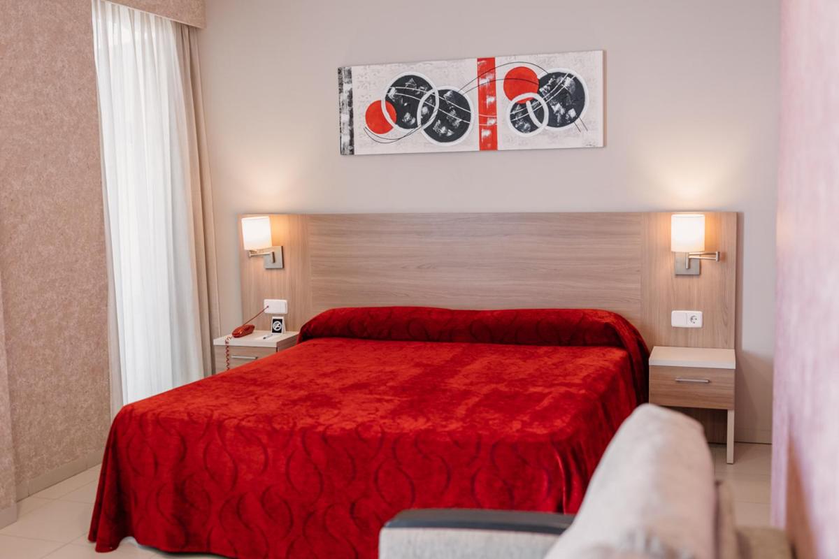 Cama o camas de una habitación en Hotel Lodomar Spa & Talasoterapia
