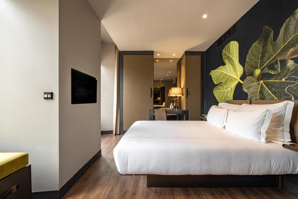Uma cama ou camas num quarto em Figueira by The Beautique Hotels & Spa