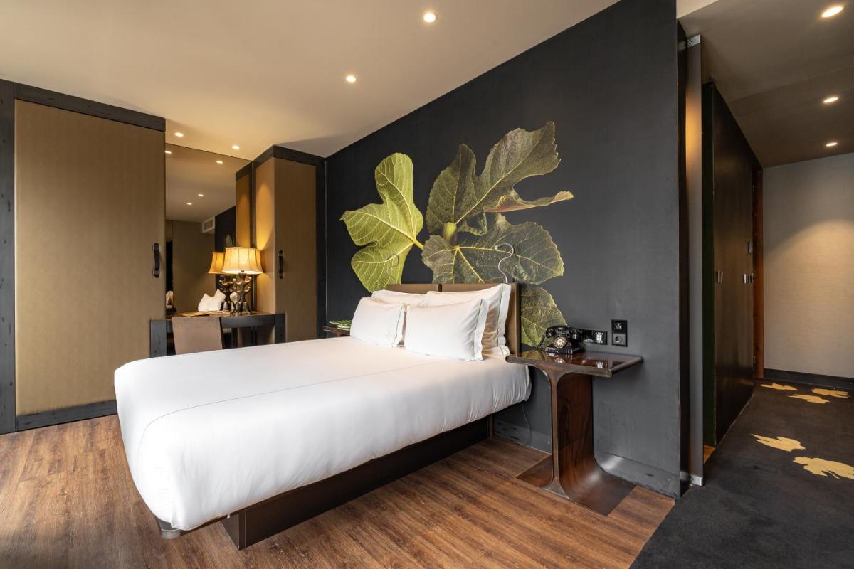 Uma cama ou camas num quarto em Figueira by The Beautique Hotels & Spa