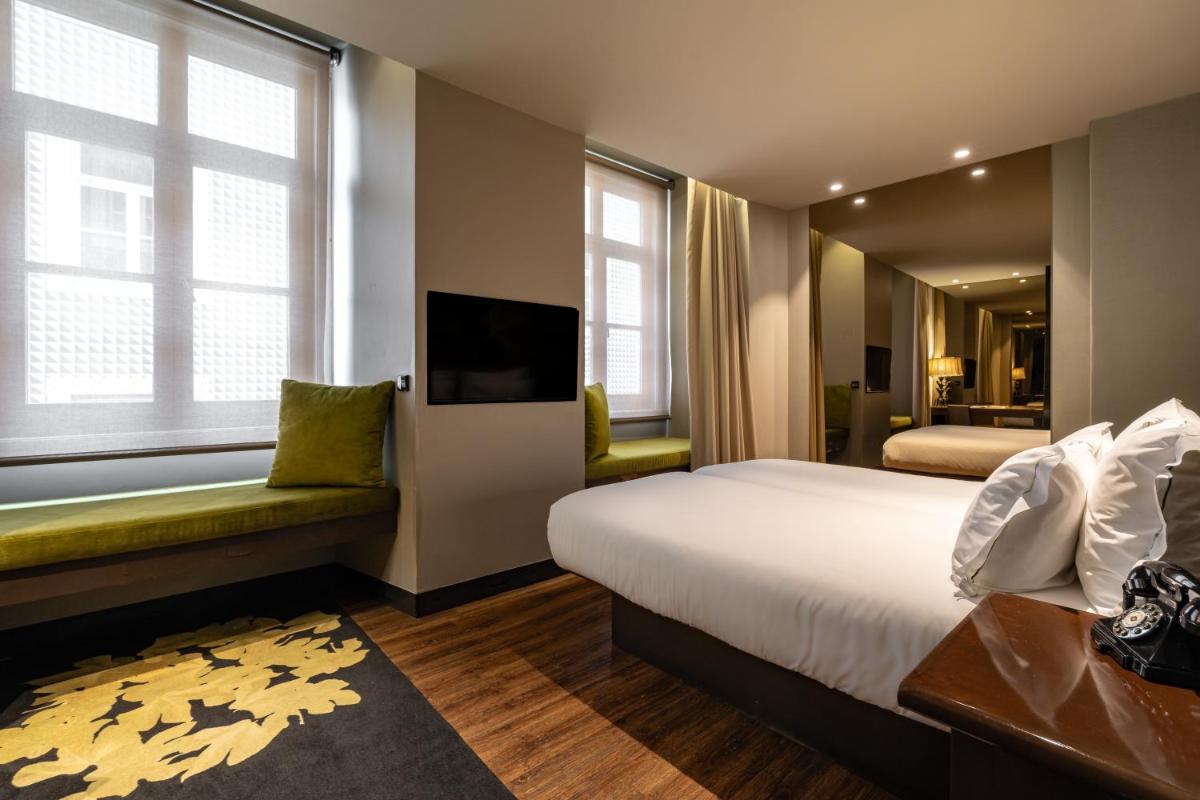 Uma televisão e/ou sistema de entretenimento em Figueira by The Beautique Hotels & Spa