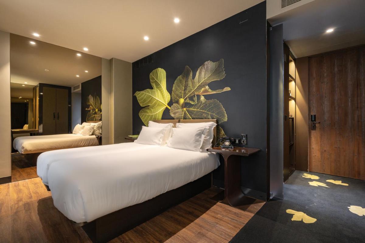 Uma cama ou camas num quarto em Figueira by The Beautique Hotels & Spa