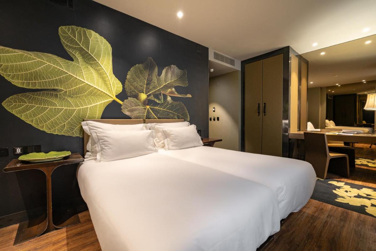 Uma cama ou camas num quarto em Figueira by The Beautique Hotels & Spa
