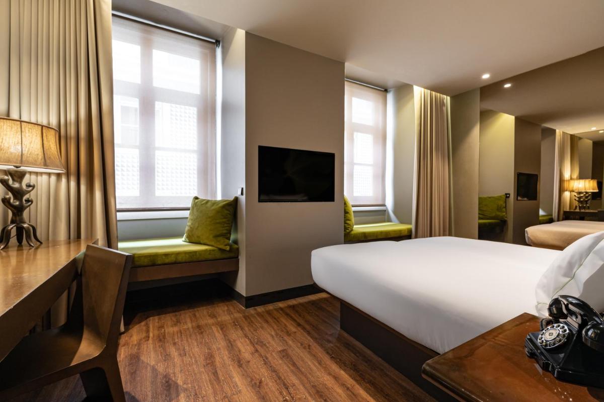 Uma cama ou camas num quarto em Figueira by The Beautique Hotels & Spa