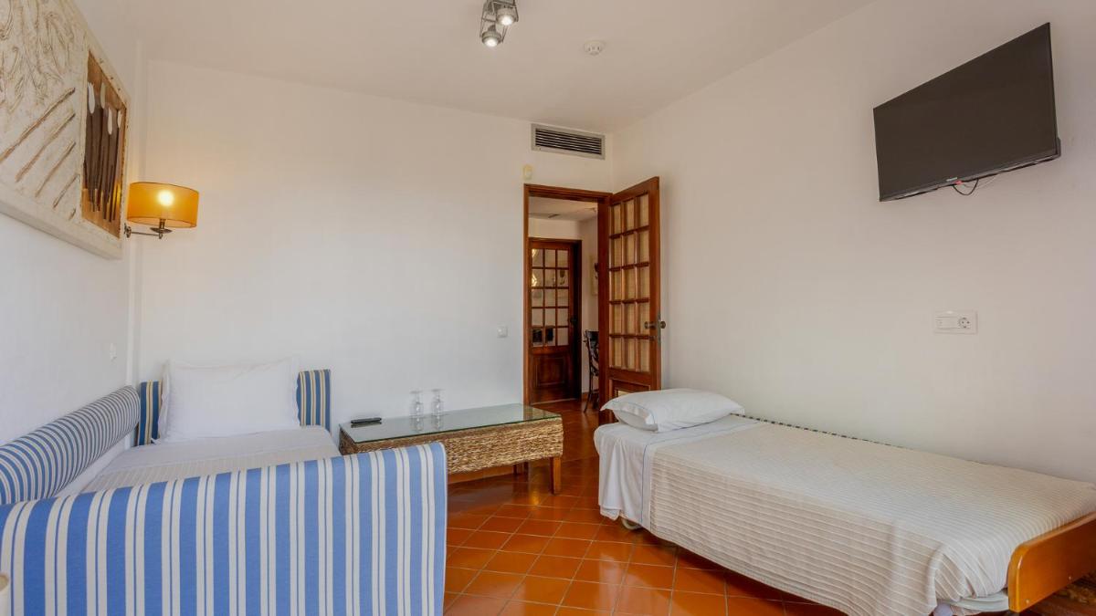 Uma cama ou camas num quarto em Hotel do Cerro