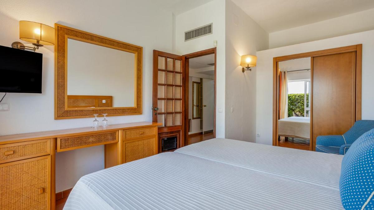 Uma cama ou camas num quarto em Hotel do Cerro