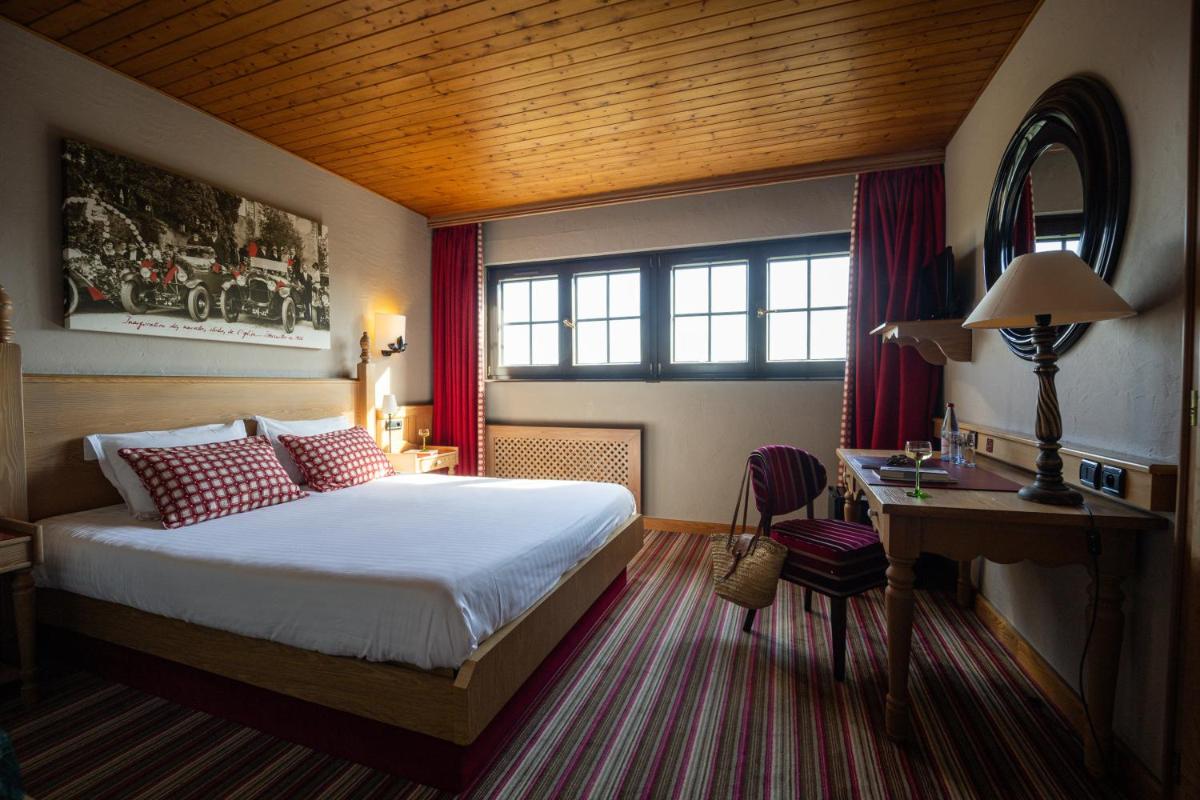 Un ou plusieurs lits dans un hébergement de l'établissement Hôtel Arnold