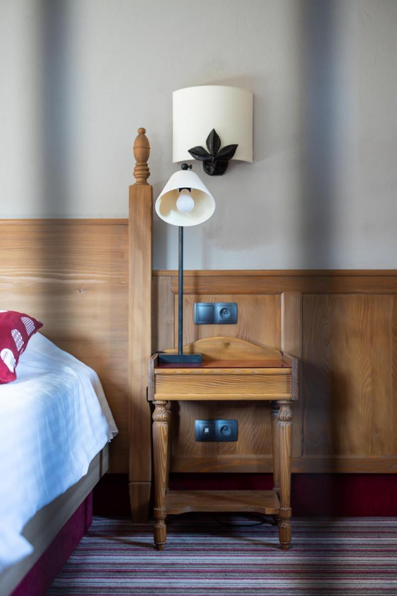Un ou plusieurs lits dans un hébergement de l'établissement Hôtel Arnold