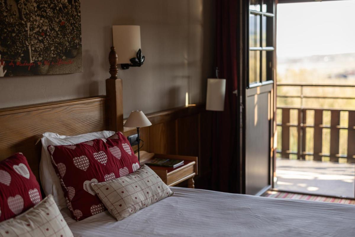 Un ou plusieurs lits dans un hébergement de l'établissement Hôtel Arnold