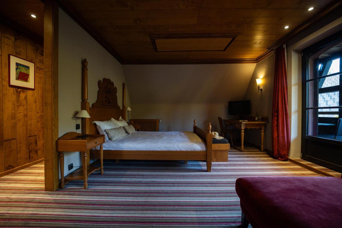 Un ou plusieurs lits dans un hébergement de l'établissement Hôtel Arnold