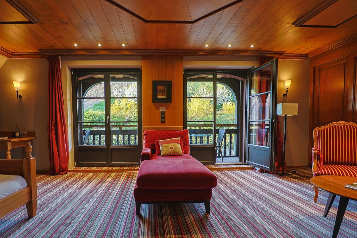 Coin salon dans l'établissement Hôtel Arnold