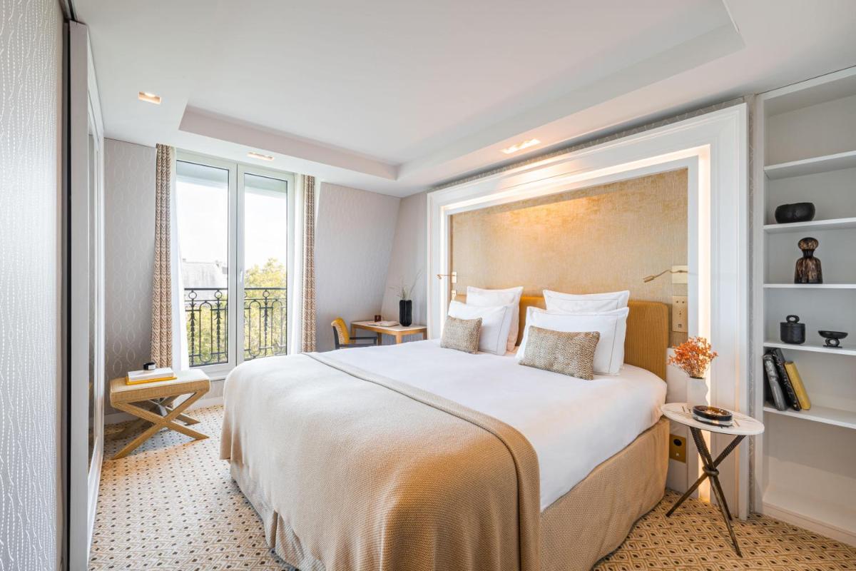 Un ou plusieurs lits dans un hébergement de l'établissement Hôtel Madison