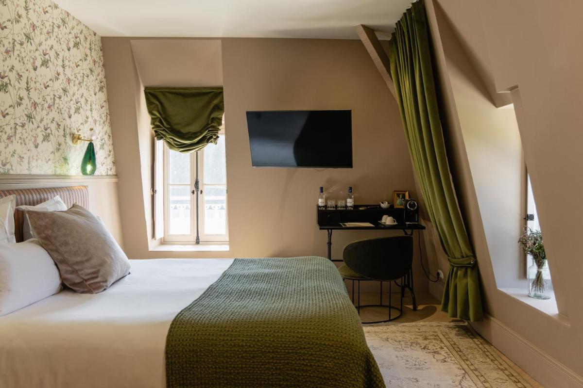 Un ou plusieurs lits dans un hébergement de l'établissement Château Léognan, Domaine viticole - proche Bordeaux