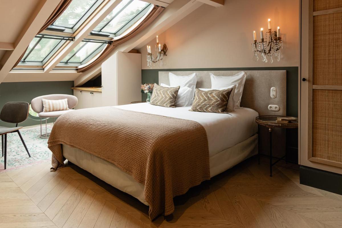 Un ou plusieurs lits dans un hébergement de l'établissement Château Léognan, Domaine viticole - proche Bordeaux