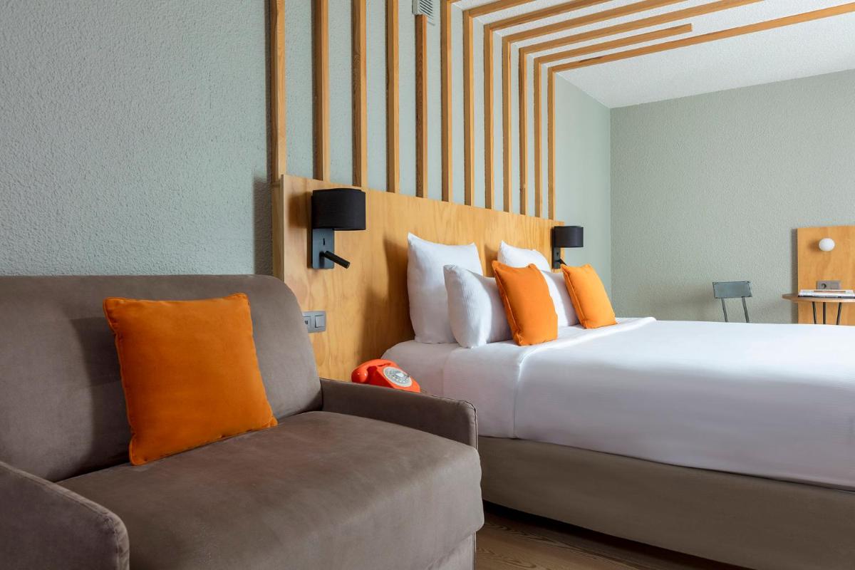 Un ou plusieurs lits dans un hébergement de l'établissement Hôtel Les Aiglons Chamonix