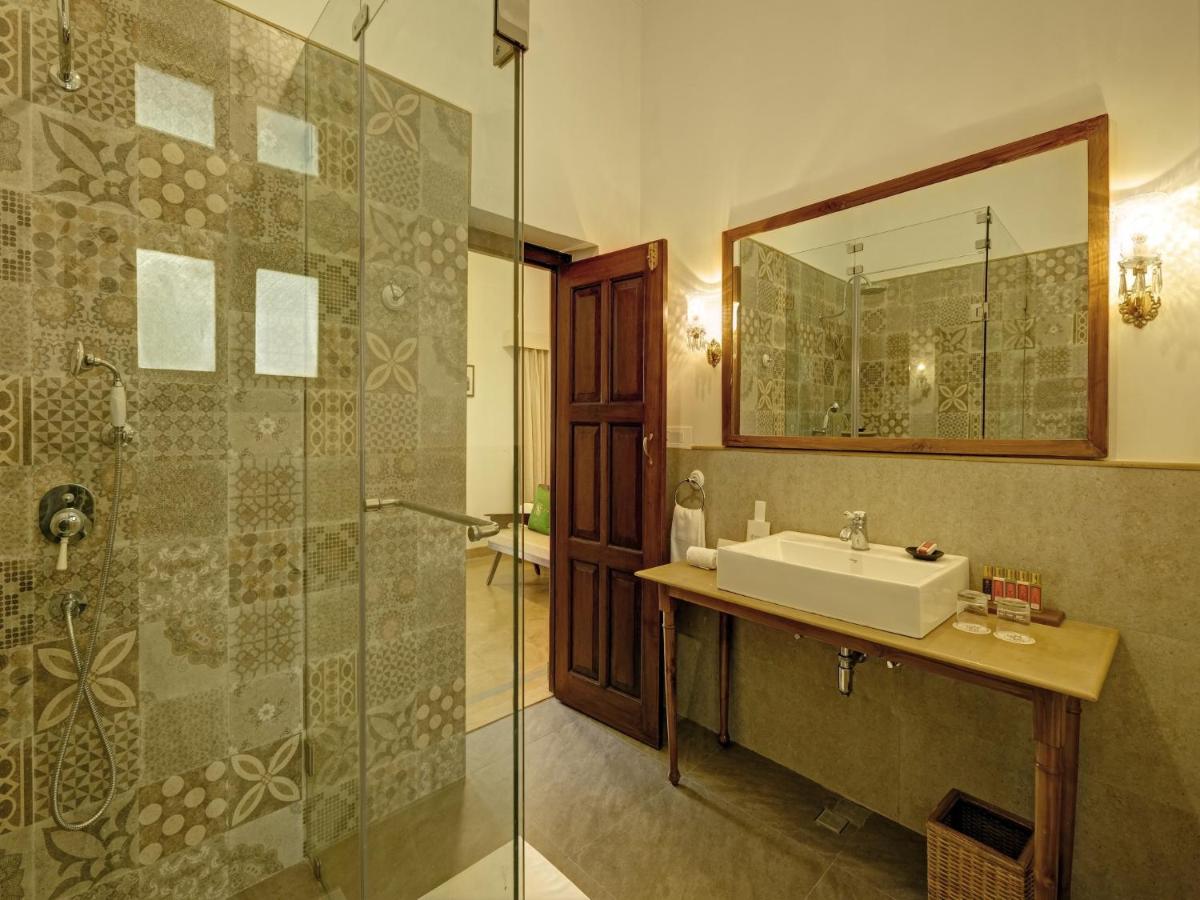 a bathroom with a sink and a shower at Saraca Hotel Lucknow in Lucknow