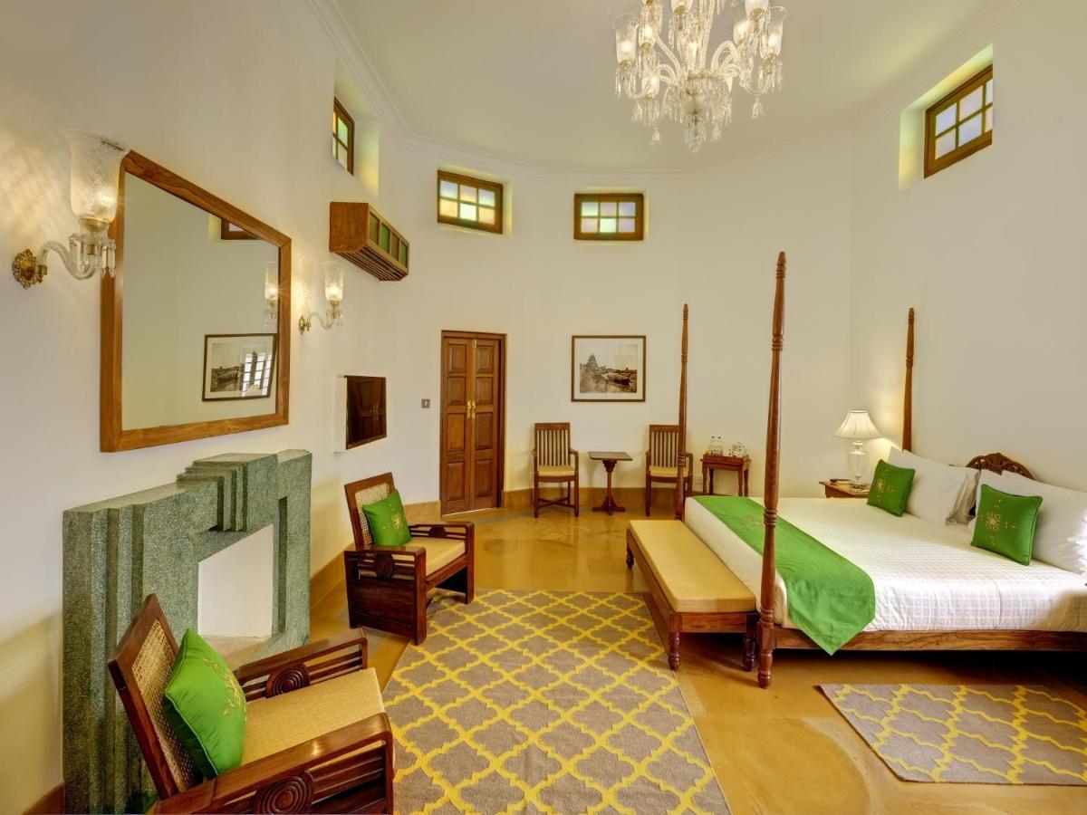a large room with a bed and a mirror at Saraca Hotel Lucknow in Lucknow +53 photos