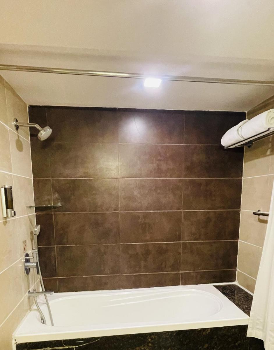 a bathroom with a large shower with a tub at Fortune JP Palace, Mysore - Member ITC Hotels' Group in Mysore