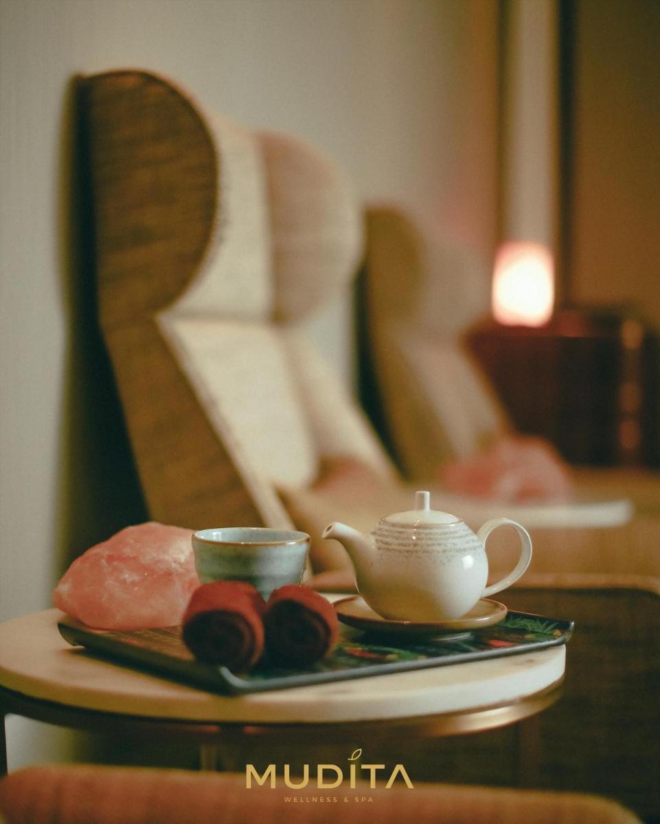 a plate of food and a tea pot on a table at Hyatt Regency Jaipur Mansarovar in Jaipur a plate of food and a tea pot on a table at Hyatt Regency Jaipur Mansarovar in Jaipur