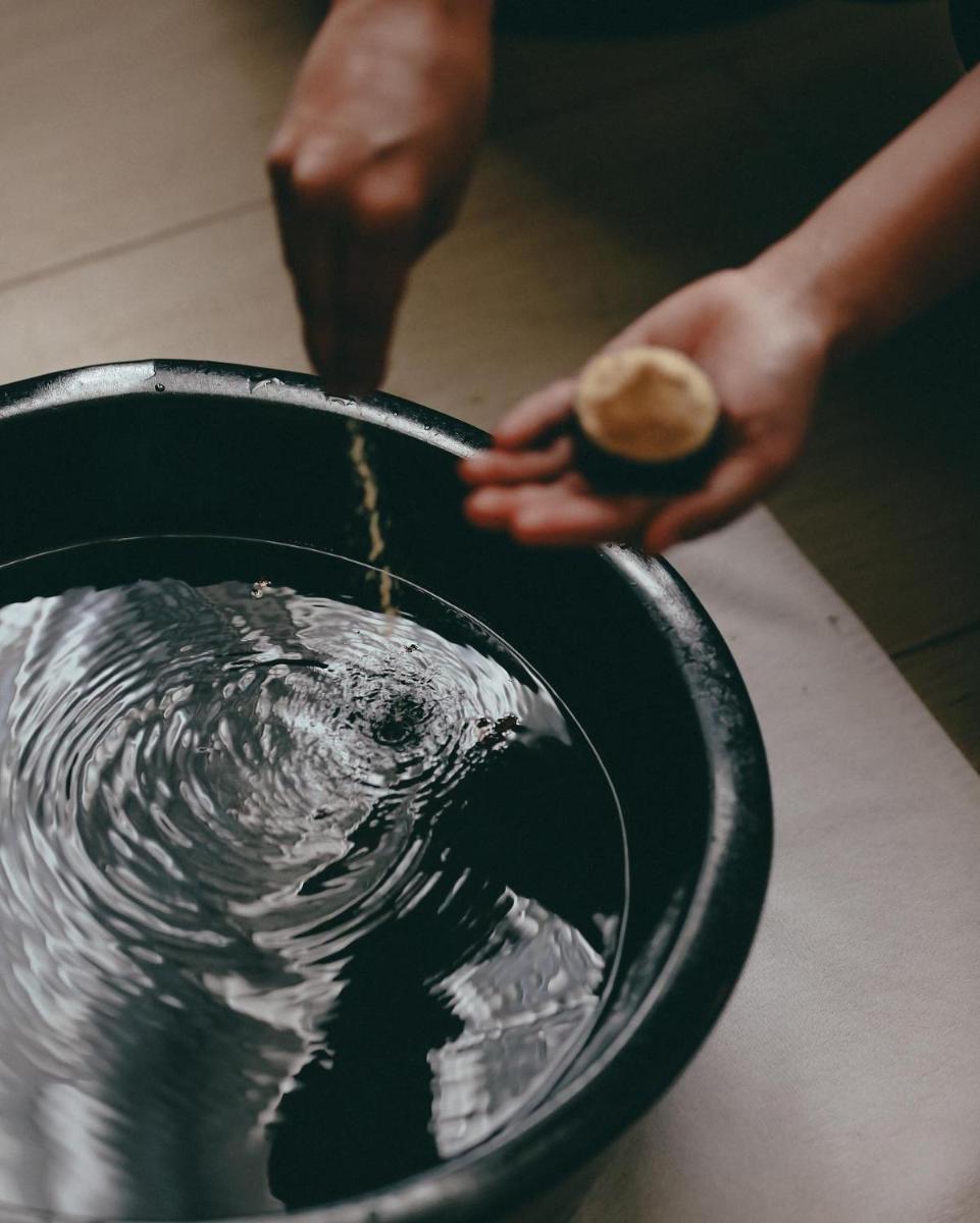 a person is pouring water into a bucket at Hyatt Regency Jaipur Mansarovar in Jaipur a person is pouring water into a bucket at Hyatt Regency Jaipur Mansarovar in Jaipur
