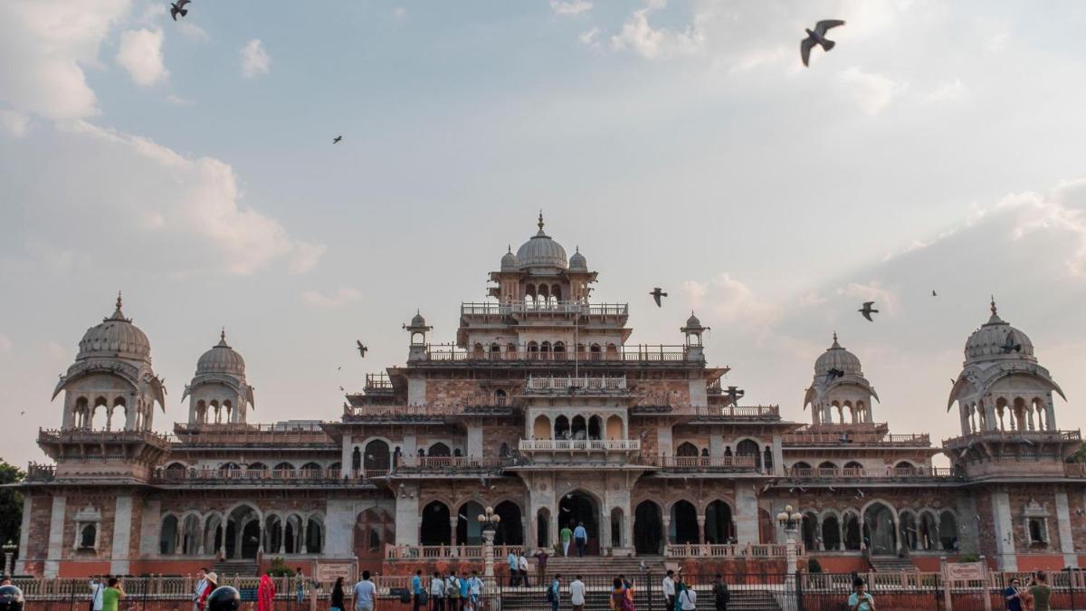 a large building with birds flying in front of it at Holiday Inn Jaipur City Centre by IHG in Jaipur a large building with birds flying in front of it at Holiday Inn Jaipur City Centre by IHG in Jaipur