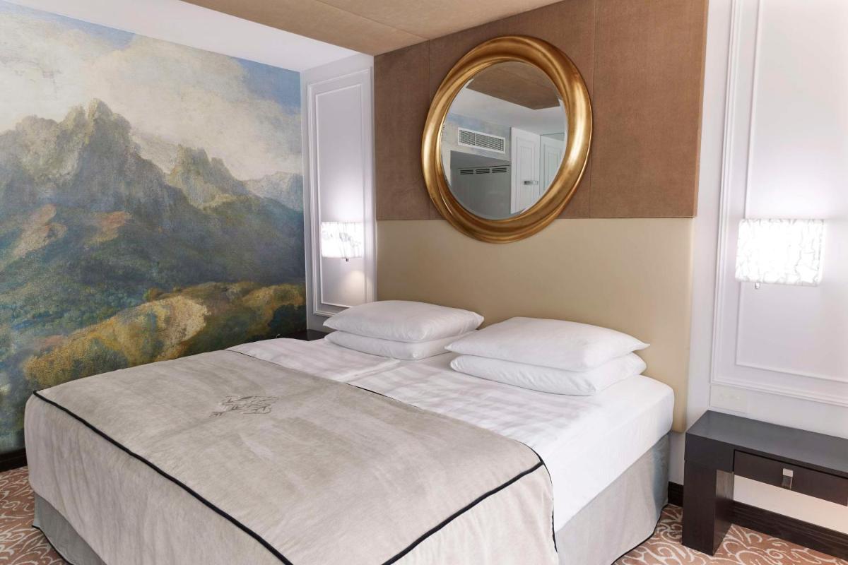 Ein Bett oder Betten in einem Zimmer der Unterkunft Vier Jahreszeiten Kempinski München Ein Bett oder Betten in einem Zimmer der Unterkunft Vier Jahreszeiten Kempinski München