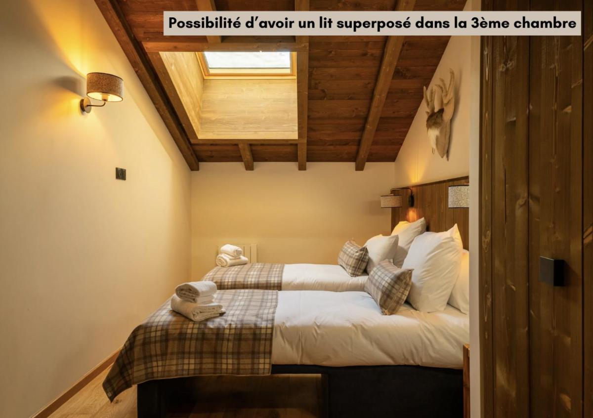 Un ou plusieurs lits dans un hébergement de l'établissement Résidence l'Ecrin d'Argent by My Mountain Resort