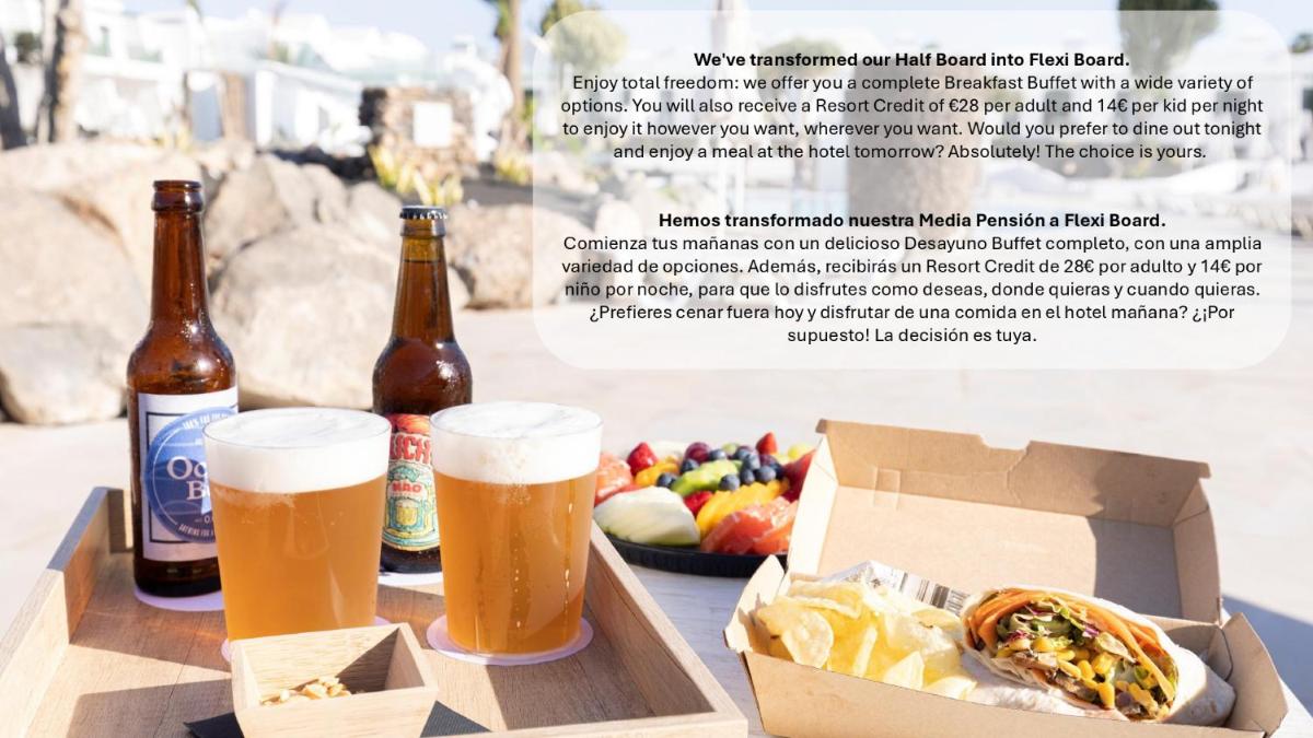 Un volante con dos cervezas y una caja de comida. en MYND Yaiza, en Playa Blanca