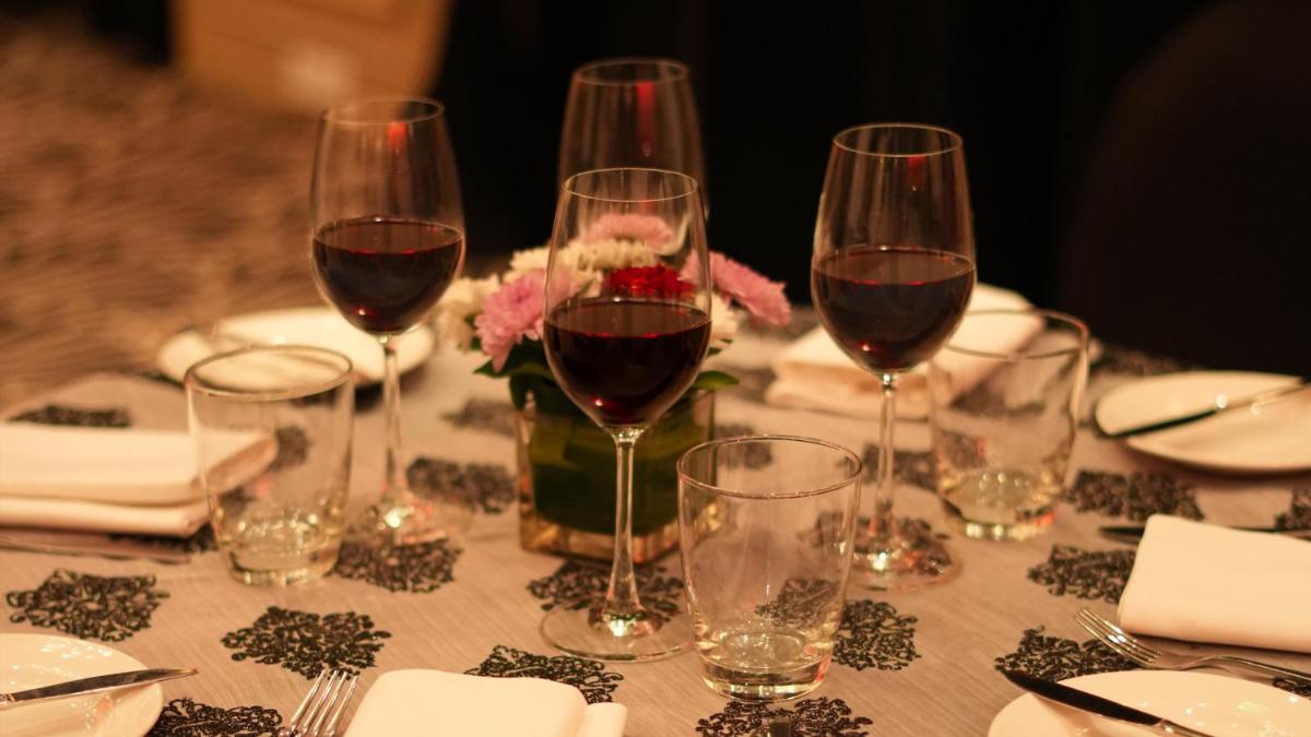 a table with three glasses of wine on it at InterContinental Marine Drive Mumbai by IHG in Mumbai