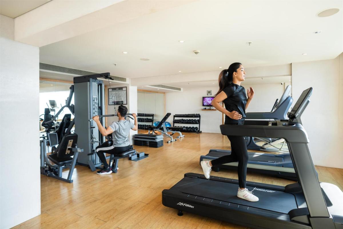 a group of people in a gym on a treadmill at DoubleTree by Hilton-Pune Chinchwad in Pune