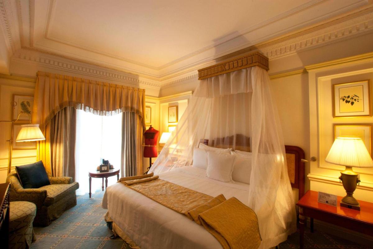 a bedroom with a bed with a canopy at ITC Windsor, a Luxury Collection Hotel, Bengaluru in Bengaluru a bedroom with a bed with a canopy at ITC Windsor, a Luxury Collection Hotel, Bengaluru in Bengaluru